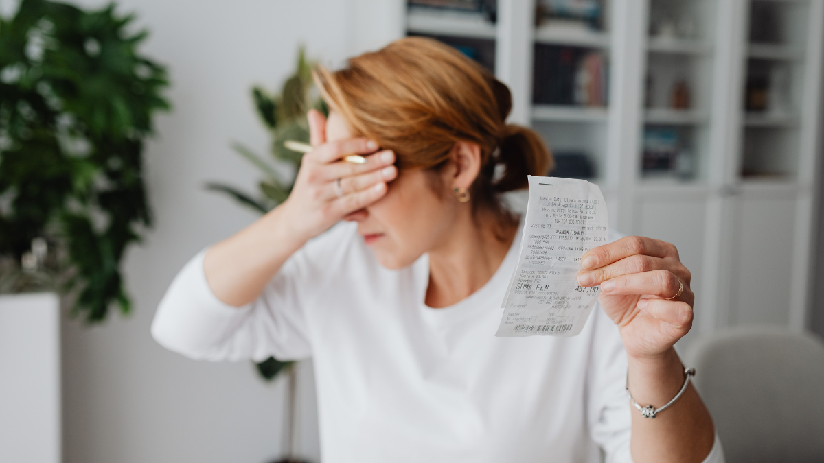 woman overwhelmed by bills for medicine and medical.
