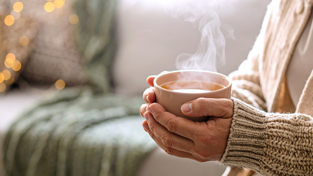 Hands holding a warm cup during a quiet moment of rest