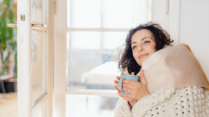woman relaxing in bed with coffee